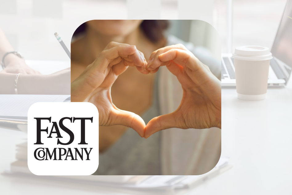 A woman making a heart with her hands next to the Fast Company logo
